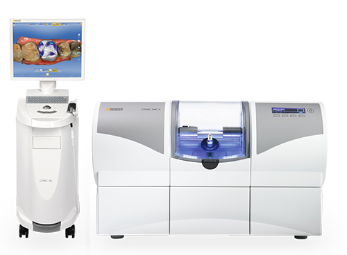 The image shows a dental office setup with a digital display screen, a dental machine, and a 3D printer on a table.